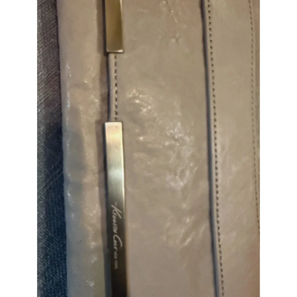 Beautiful Cream leather clutch with detachable shoulder strap by Kenneth Cole